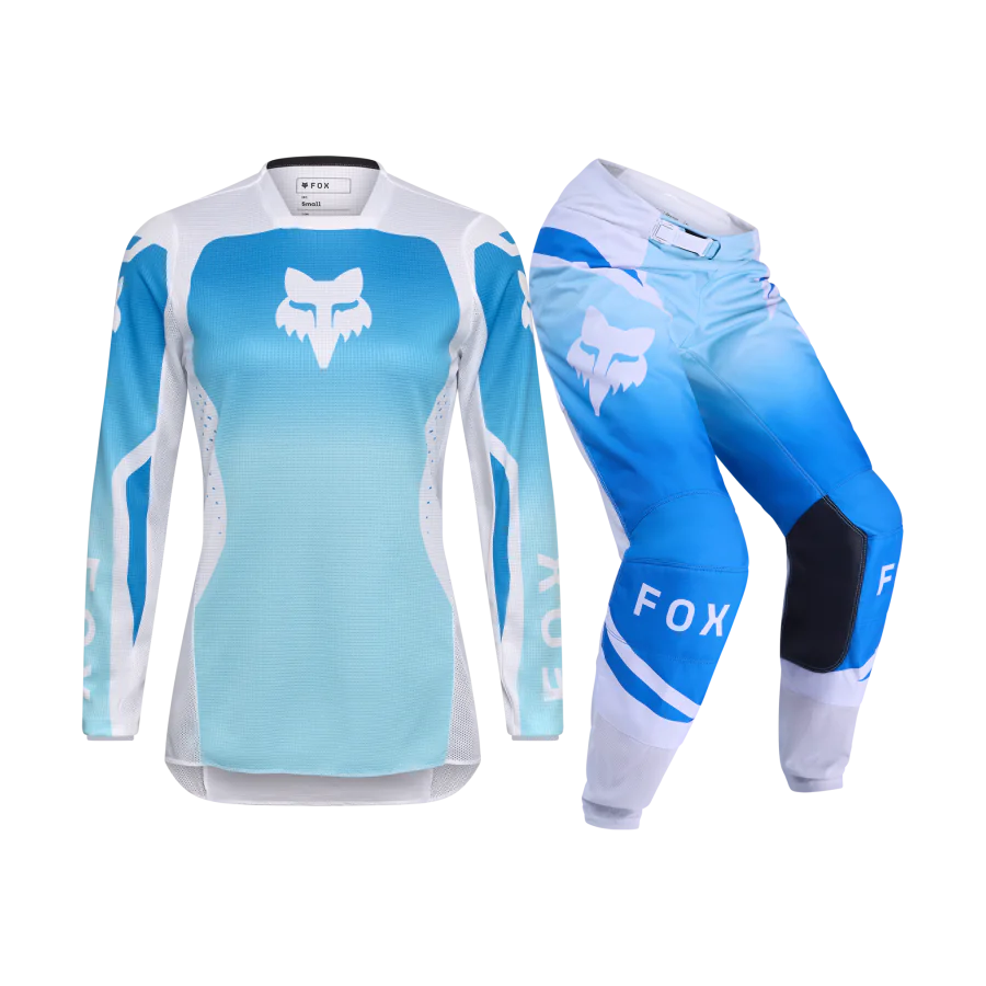 fox-dames-crosskleding-2026-180-shield-wit-blauw-1.png